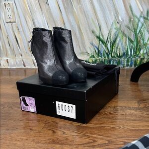 CHANEL Shimmering Black Heeled Boots